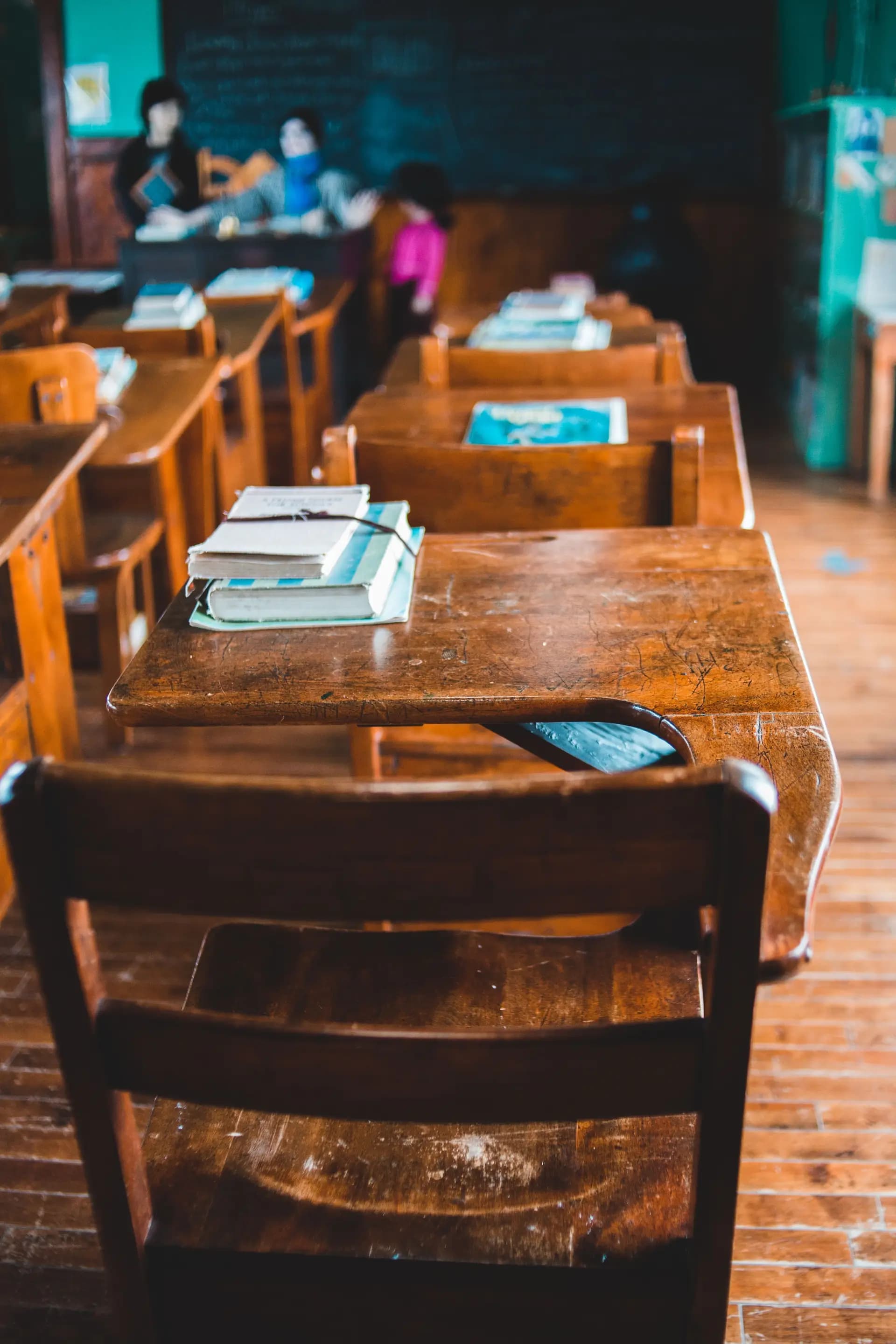 An empty classroom with rows of desks ready for the school day